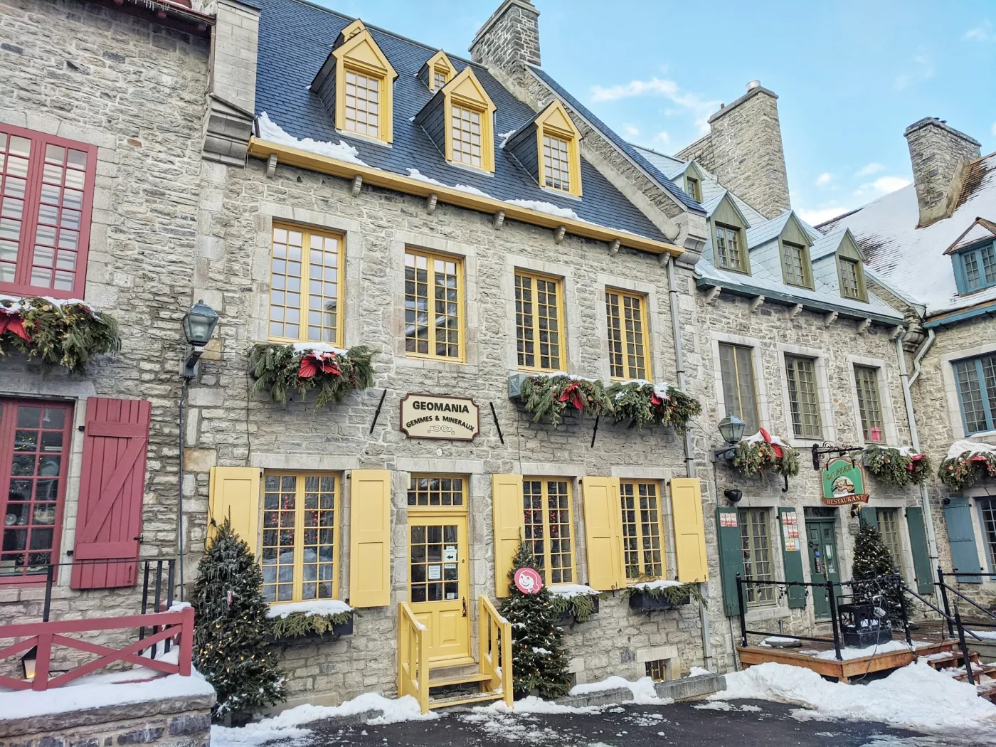 Snow on the window boxes of an old stone street in Quebec City